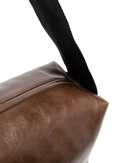 Uma Wangembossed-logo detail shoulder bag
